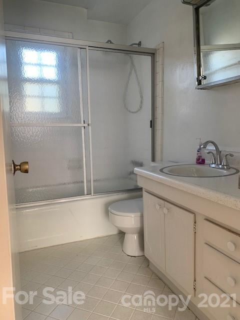 916 McAlway Road Charlotte, NC 28211 - Photo 8 of 9 a bathroom with a granite countertop sink a toilet and shower