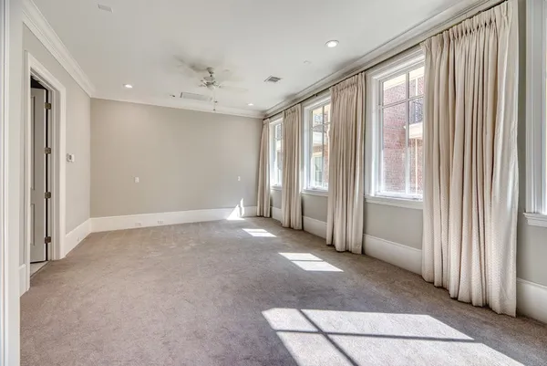 a view of a livingroom with a fireplace and window