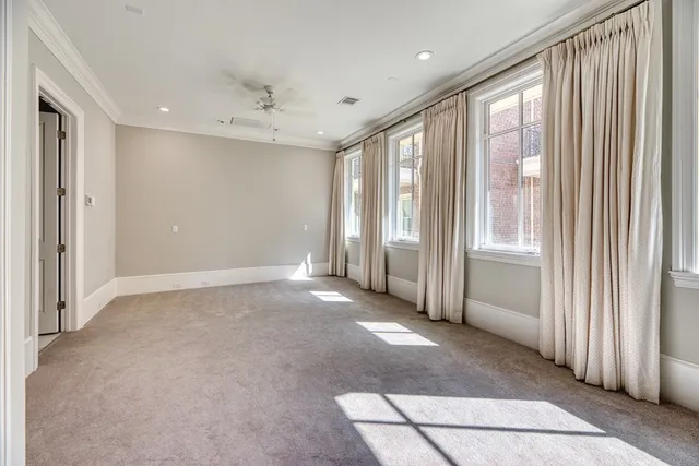 a view of a livingroom with a fireplace and window