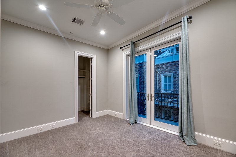 1913 Revere Street Houston, TX 77019 - Photo 18 of 40 an empty room with closet and a ceiling fan