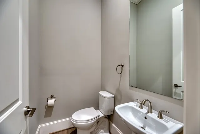 a bathroom with a bathtub and double sink