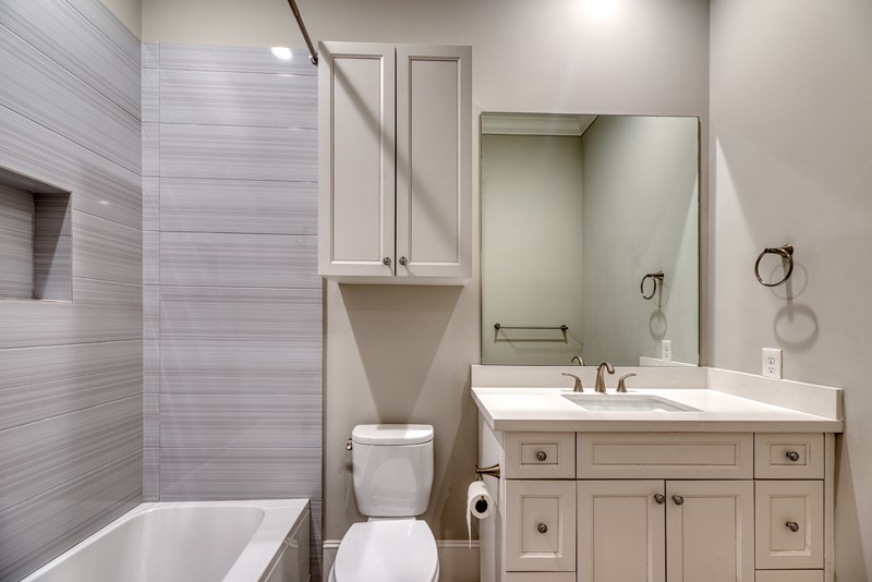 1913 Revere Street Houston, TX 77019 - Photo 25 of 40 a bathroom with a sink toilet and shower