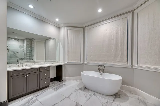 front view of a brick house with a yard