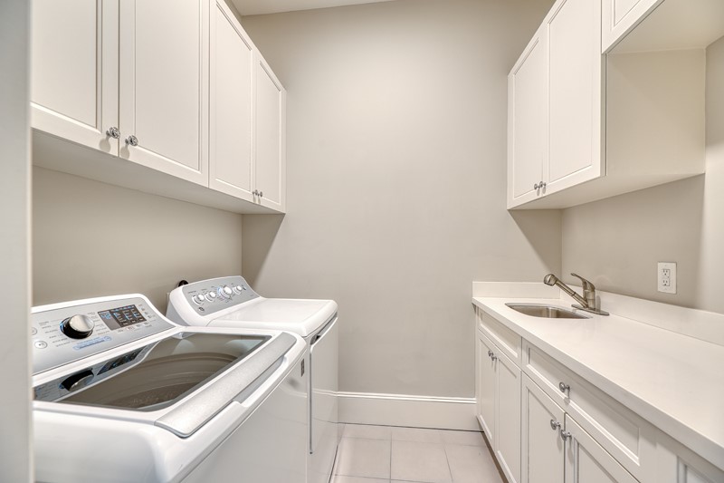 1913 Revere Street Houston, TX 77019 - Photo 29 of 40 a utility room with dryer and washer