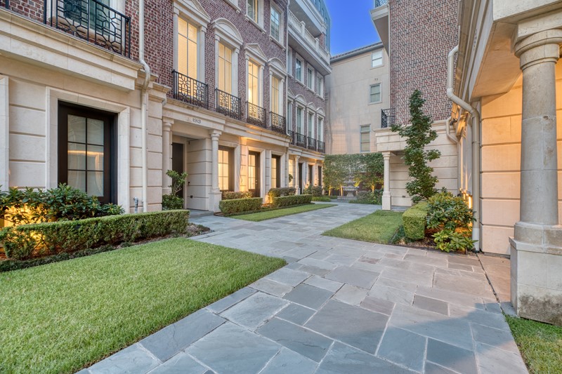 1913 Revere Street Houston, TX 77019 - Photo 31 of 40 front view of a brick house with a yard