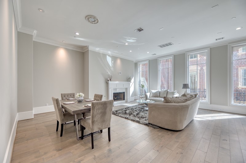 1913 Revere Street Houston, TX 77019 - Photo 5 of 40 a living room with furniture a large window and wooden floor
