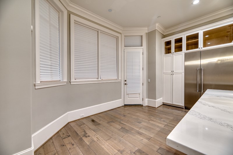 1913 Revere Street Houston, TX 77019 - Photo 9 of 40 a view of empty room with wooden floor