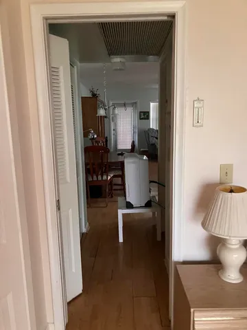 a view of living room with furniture and lamp