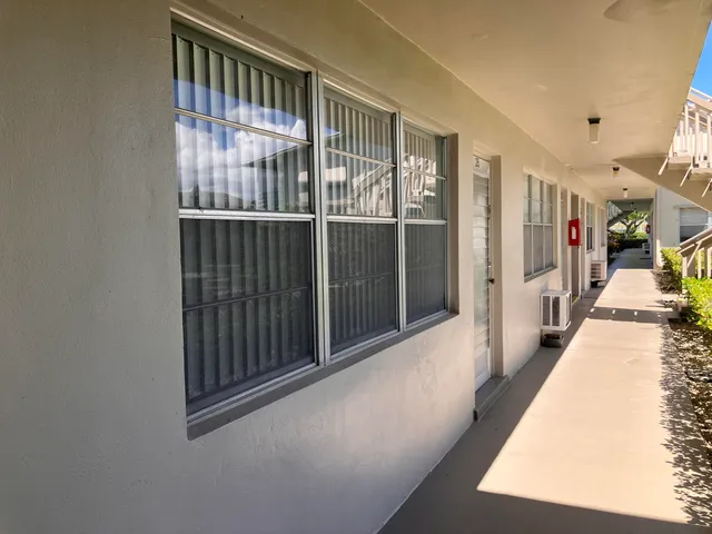 a view of gallery with wooden floor