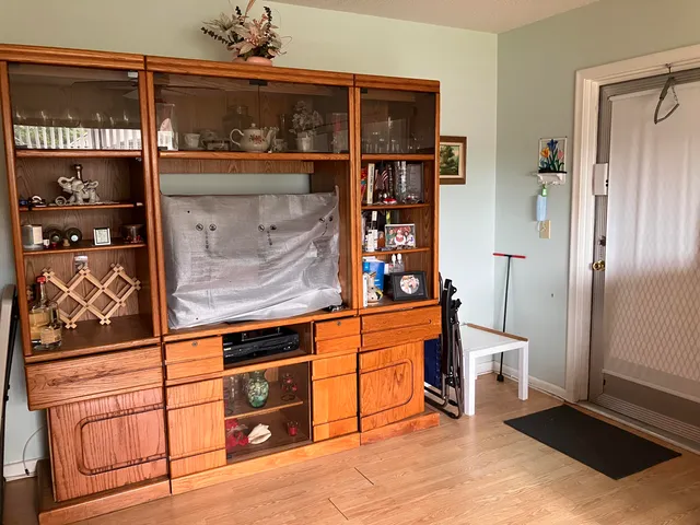 a view of an entryway with wooden floor