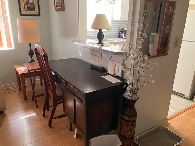 a kitchen with stainless steel appliances a sink and a refrigerator
