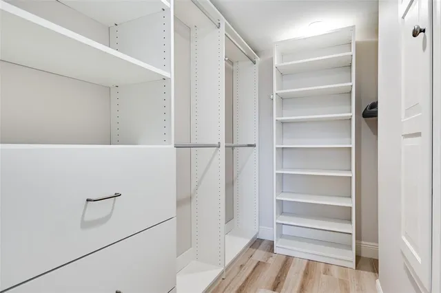 a view of an empty walk in closet