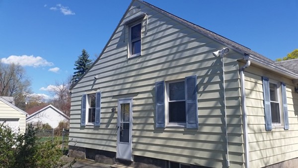 207 Edendale Street Springfield, MA 01104 - Photo 4 of 21 a front view of a house with a balcony