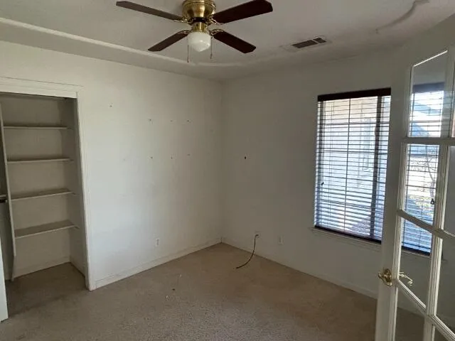 a view of a storage and utility room with a window