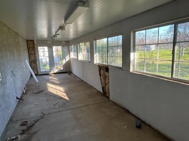 a view of a back yard of the house and green space