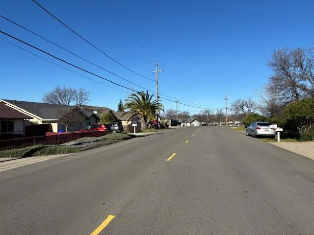 a view of a lake with houses in the back