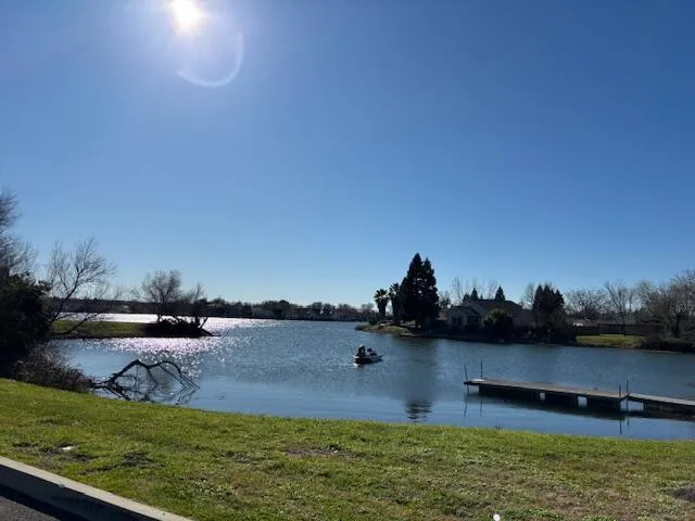 a view of a street with a yard