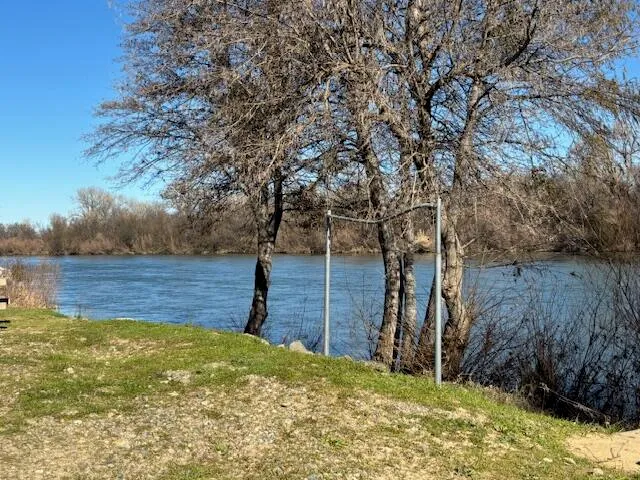 a view of a pool with a yard