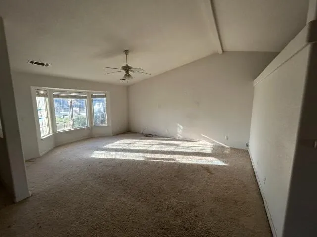 a kitchen with a stove sink and a refrigerator