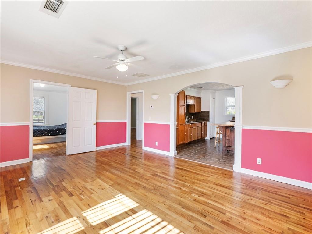 1686 Shoal Creek Road Monroe, GA 30656 - Photo 4 of 50 a view of an empty room with kitchen and window