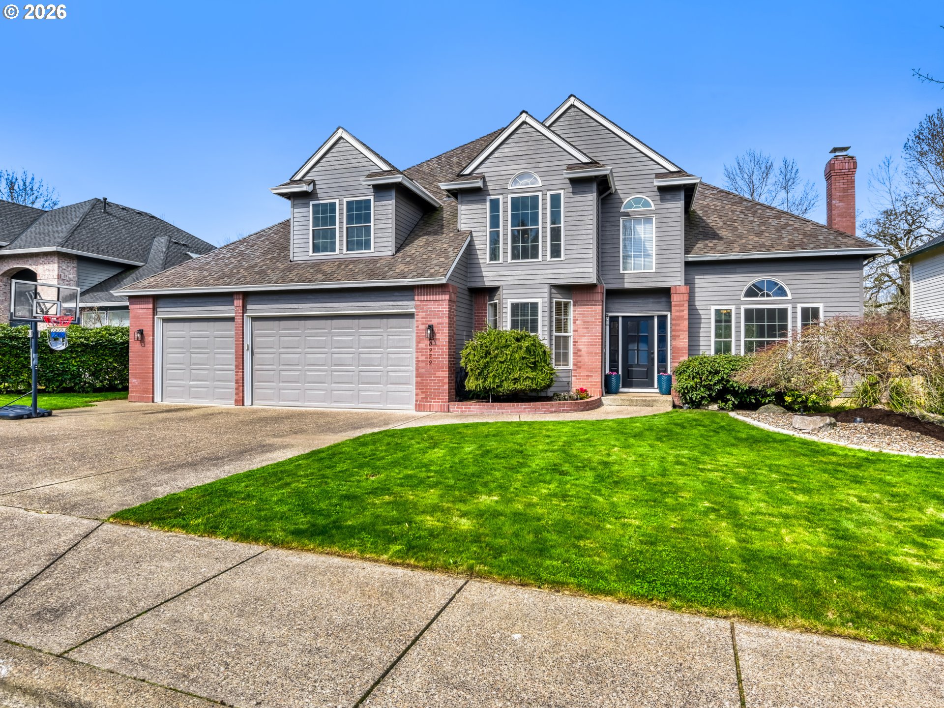 10979 Southwest Matzen Drive Wilsonville, OR 97070 - Photo 1 of 37 a front view of a house with a yard and garage