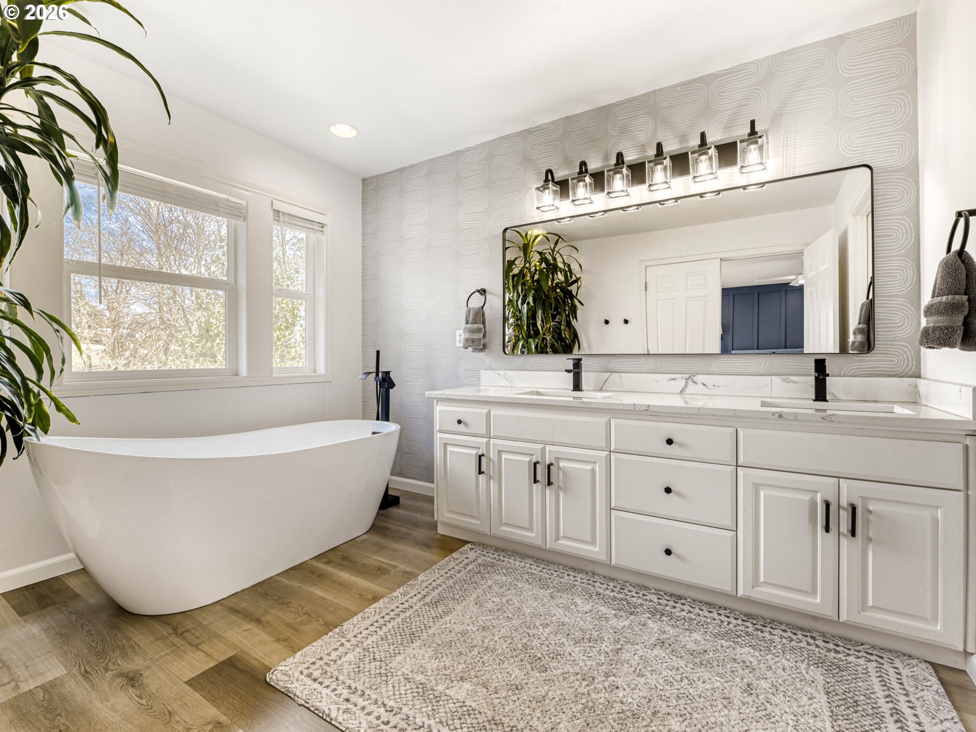 10979 Southwest Matzen Drive Wilsonville, OR 97070 - Photo 16 of 37 a spacious bathroom with a double vanity sink mirror and bathtub