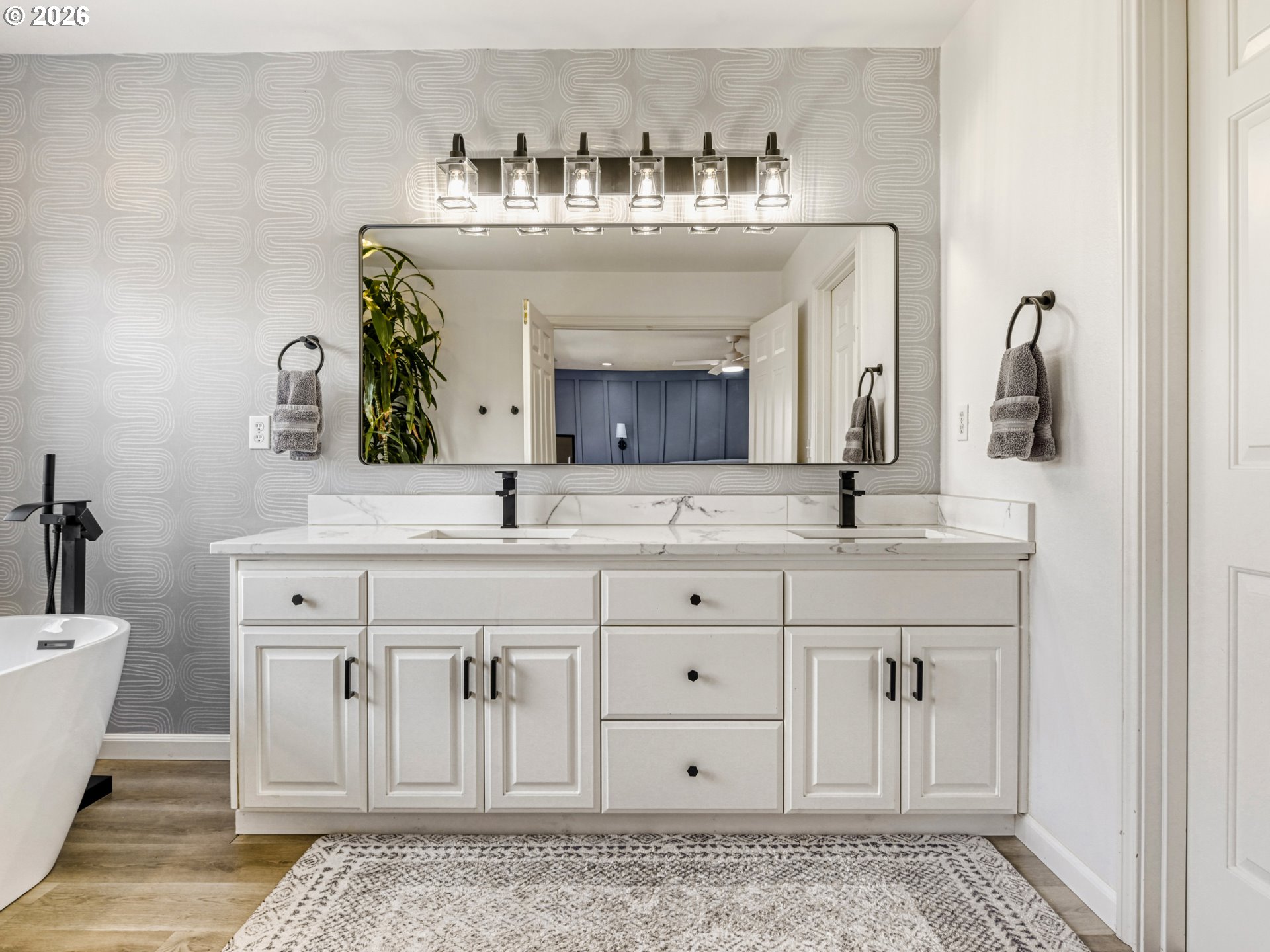 10979 Southwest Matzen Drive Wilsonville, OR 97070 - Photo 17 of 37 a bathroom with a sink and a mirror