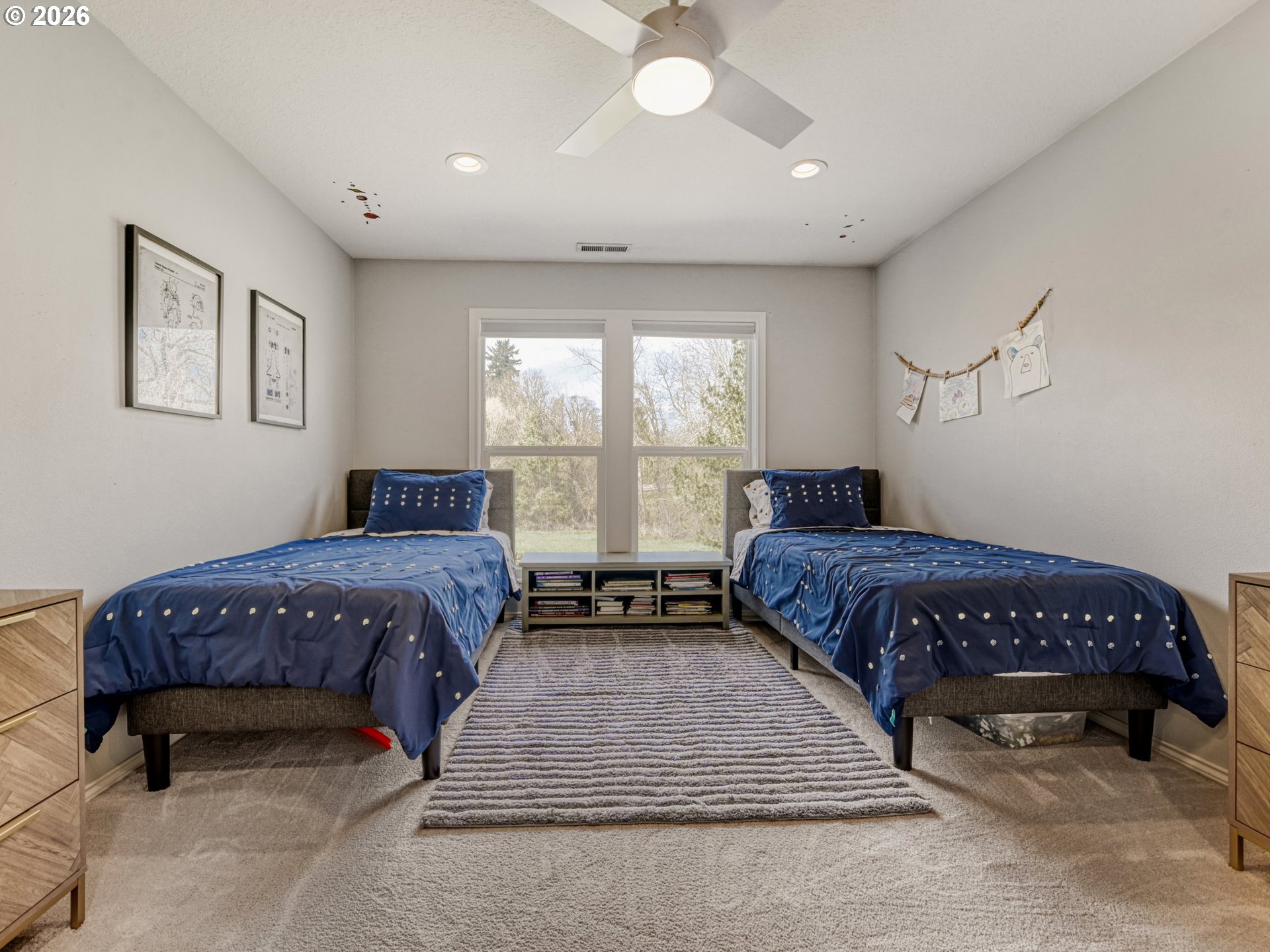 10979 Southwest Matzen Drive Wilsonville, OR 97070 - Photo 19 of 37 a spacious bedroom with a bed and a window