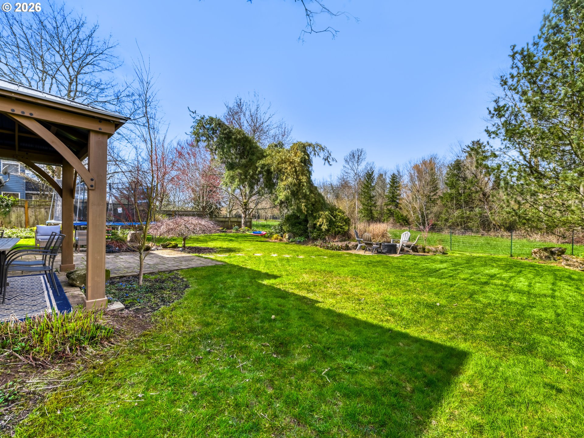 10979 Southwest Matzen Drive Wilsonville, OR 97070 - Photo 26 of 37 a backyard of a house with lots of green space