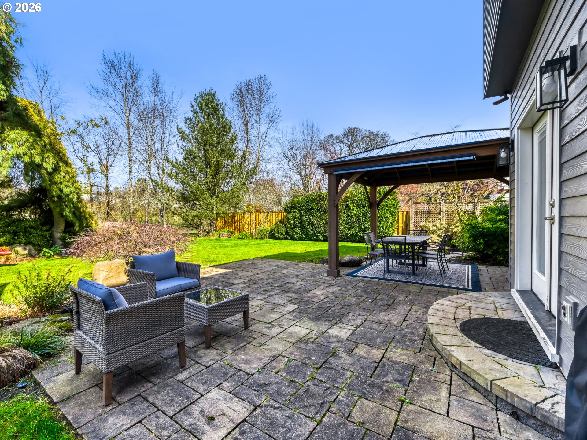 10979 Southwest Matzen Drive Wilsonville, OR 97070 - Photo 28 of 37 a house view with a seating space and garden view