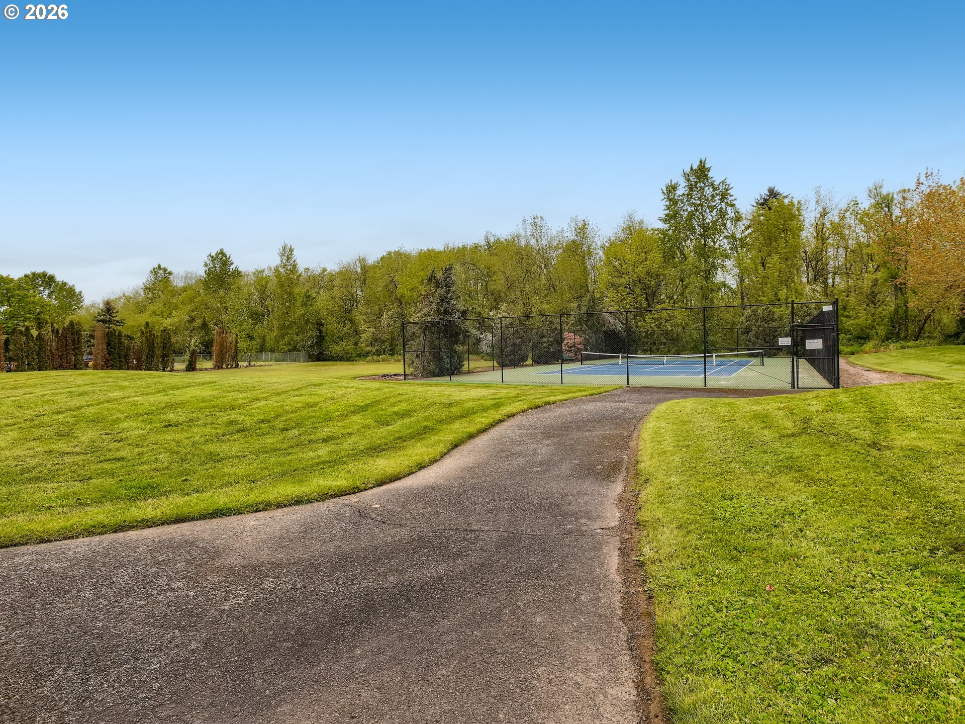 10979 Southwest Matzen Drive Wilsonville, OR 97070 - Photo 29 of 37 a view of a swimming pool and trees in the background