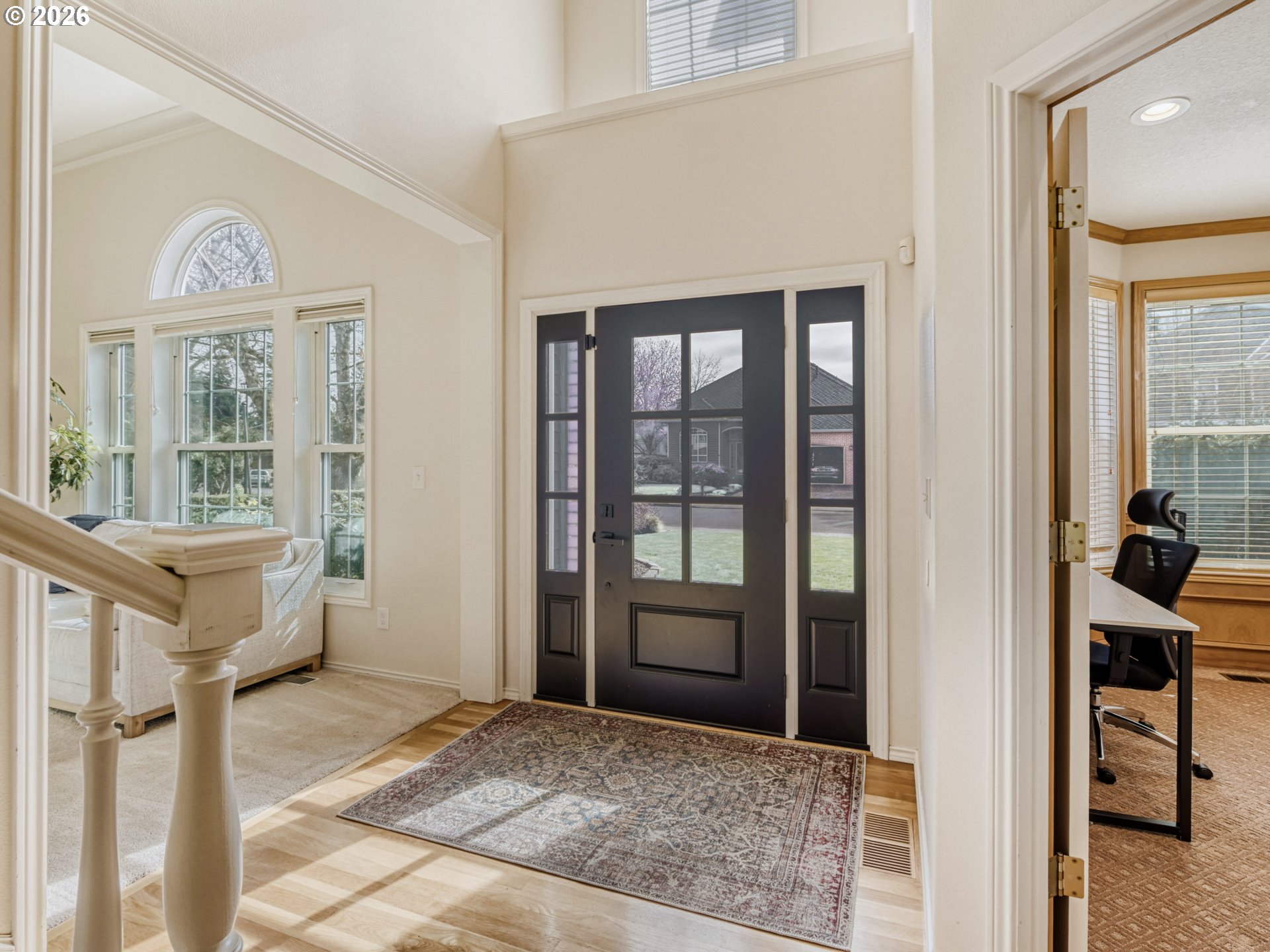 10979 Southwest Matzen Drive Wilsonville, OR 97070 - Photo 4 of 37 a view of an entryway with wooden floor and a livingroom