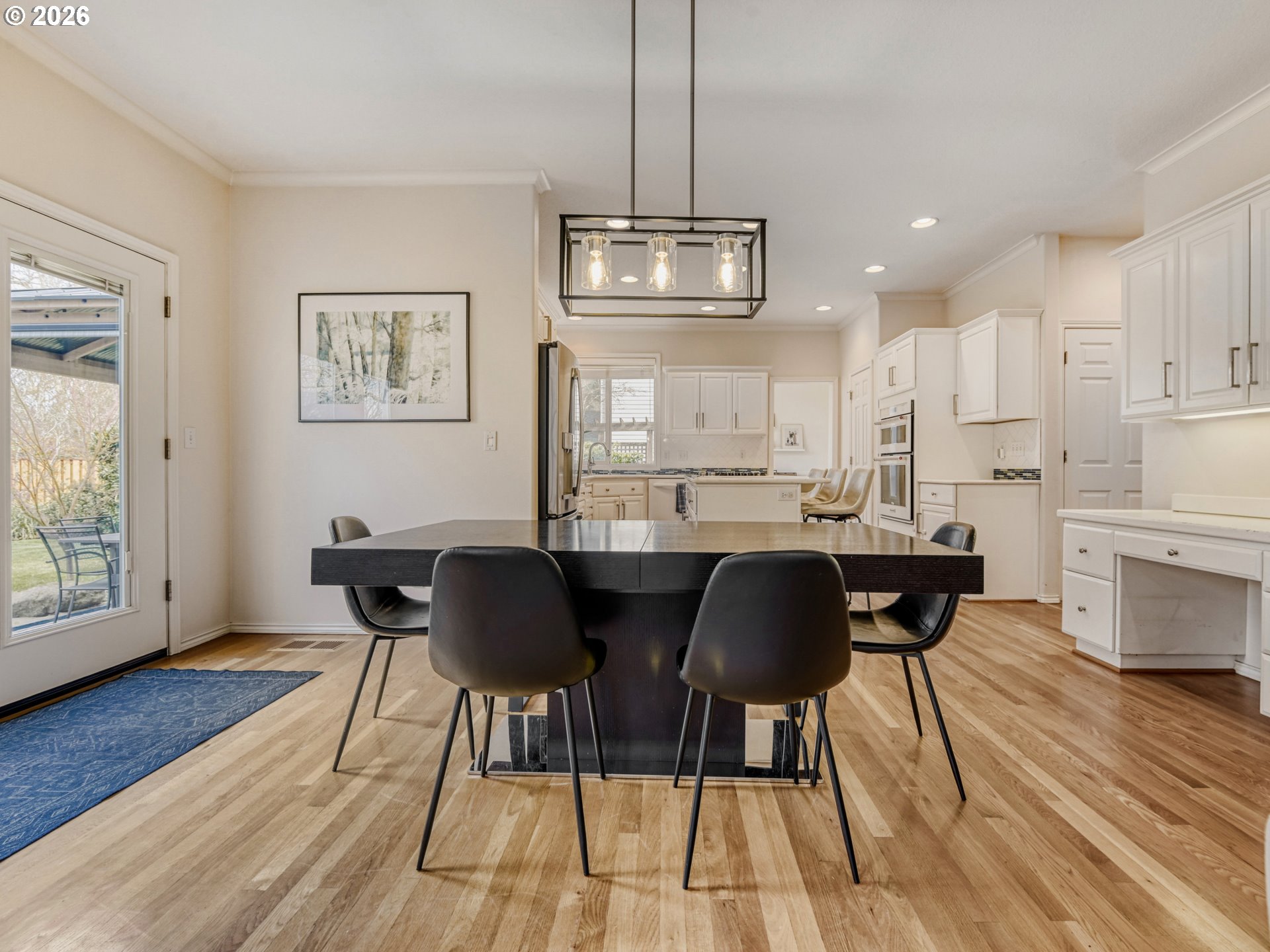 10979 Southwest Matzen Drive Wilsonville, OR 97070 - Photo 7 of 37 a view of a dining room with furniture and wooden floor