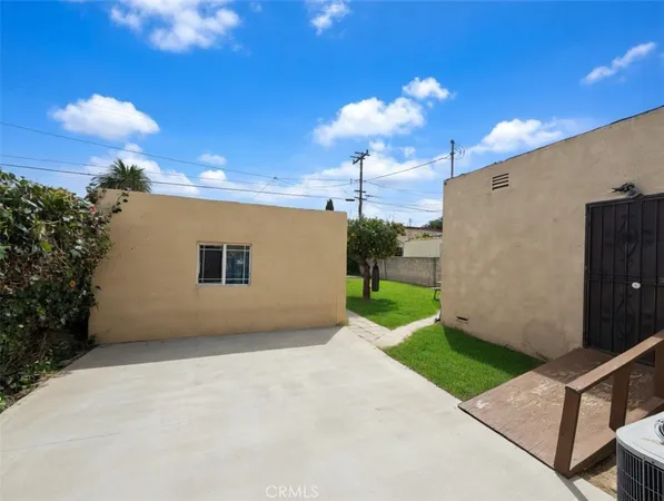 a view of a patio with a yard