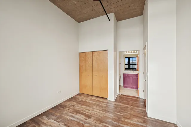 a view of hallway with wooden floor