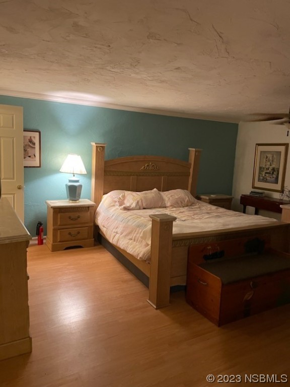 130 H H Burch Road Oak Hill, FL 32759 - Photo 13 of 24 a bedroom with a bed and a night stand