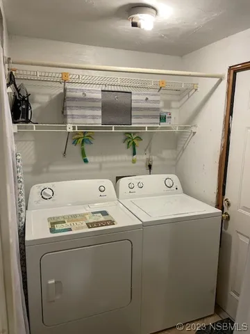 a utility room with dryer and washer