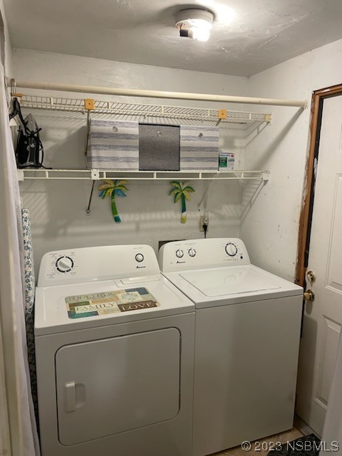 130 H H Burch Road Oak Hill, FL 32759 - Photo 17 of 24 a utility room with dryer and washer