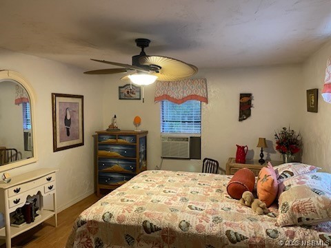 130 H H Burch Road Oak Hill, FL 32759 - Photo 7 of 24 a bedroom with a bed and a chandelier