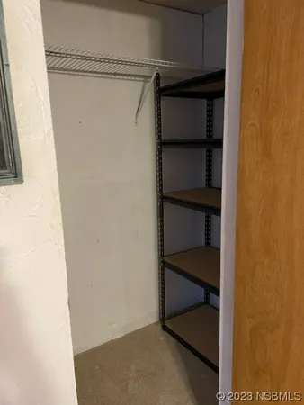 a view of an empty walk in closet