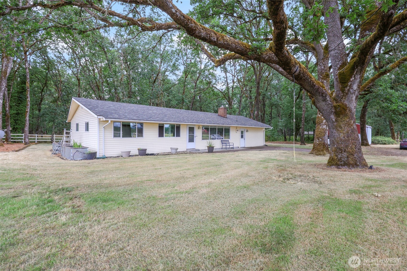 17215 Gibson Road Southwest Tenino, WA 98589 - Photo 1 of 40 a house with trees in the background