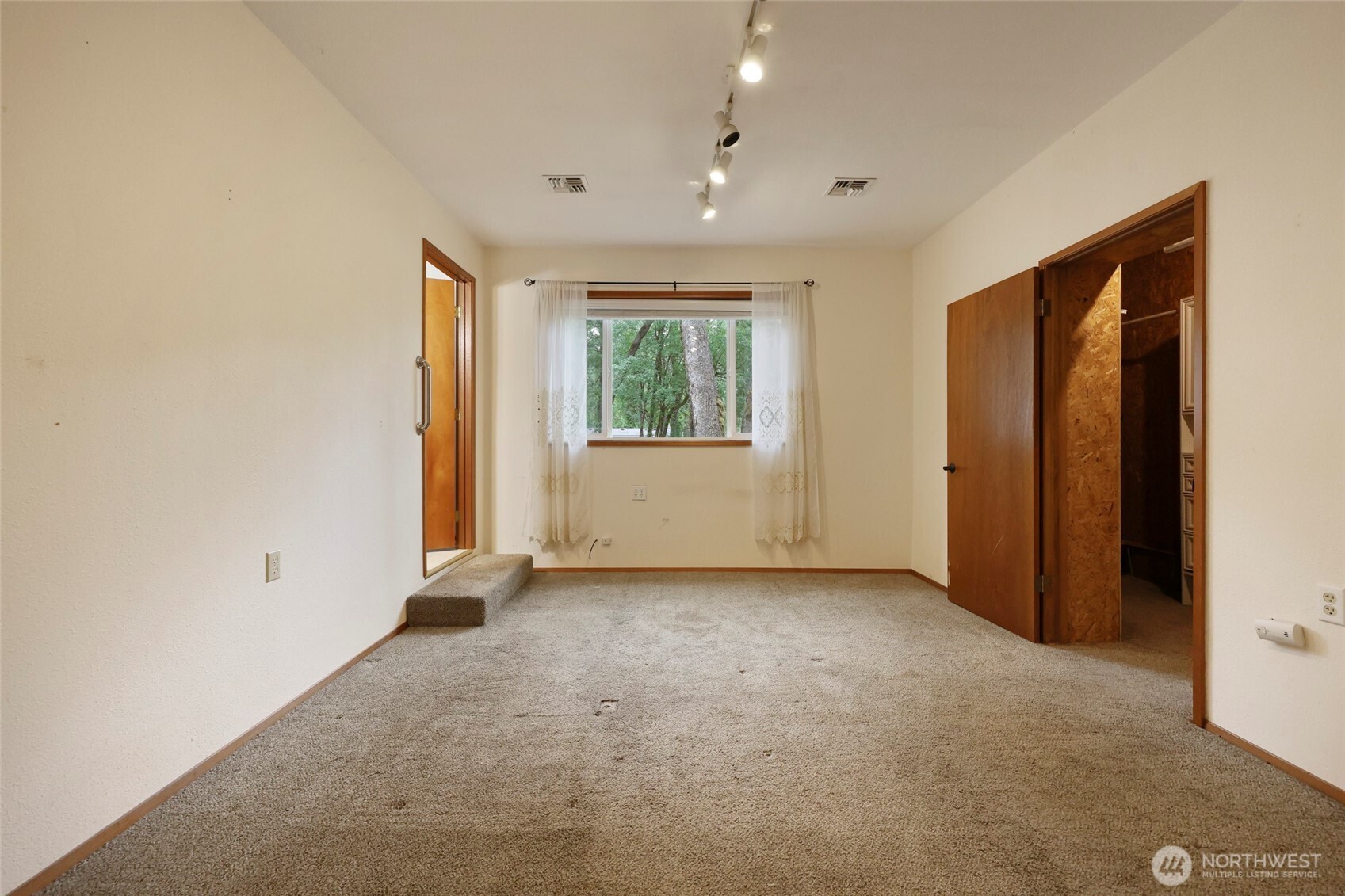 17215 Gibson Road Southwest Tenino, WA 98589 - Photo 12 of 40 an empty room with windows