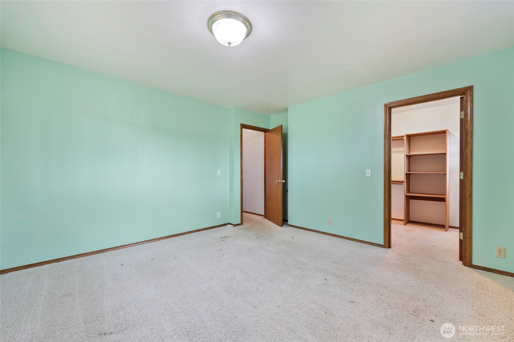 17215 Gibson Road Southwest Tenino, WA 98589 - Photo 21 of 40 an empty room with closet and windows