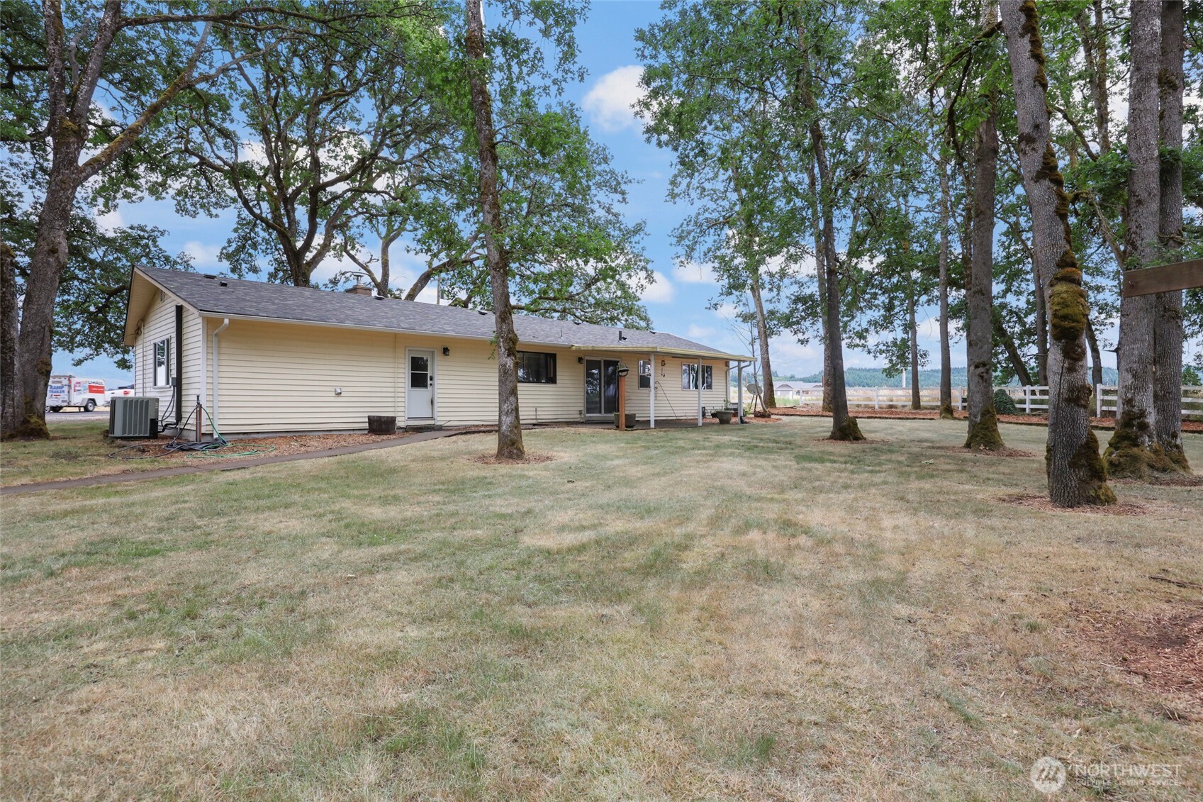 17215 Gibson Road Southwest Tenino, WA 98589 - Photo 28 of 40 a front view of a house with a yard and garage