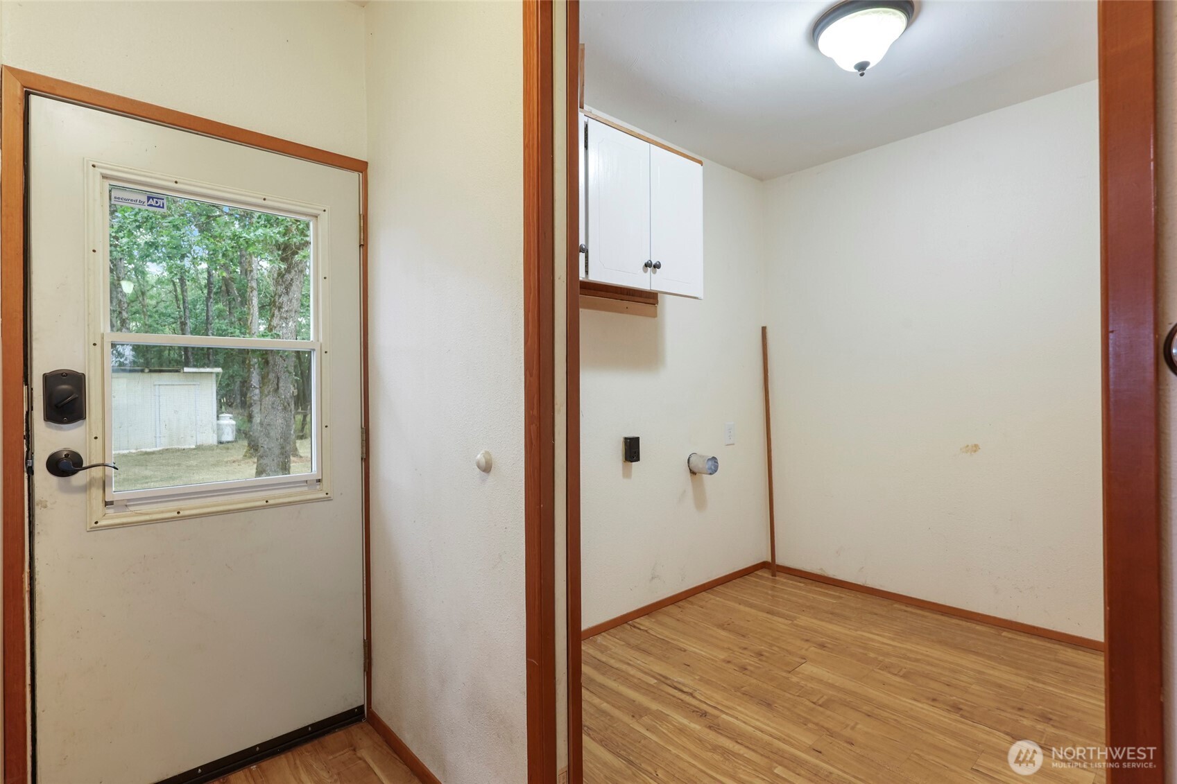 17215 Gibson Road Southwest Tenino, WA 98589 - Photo 34 of 40 a view of a livingroom with wooden floor and a window