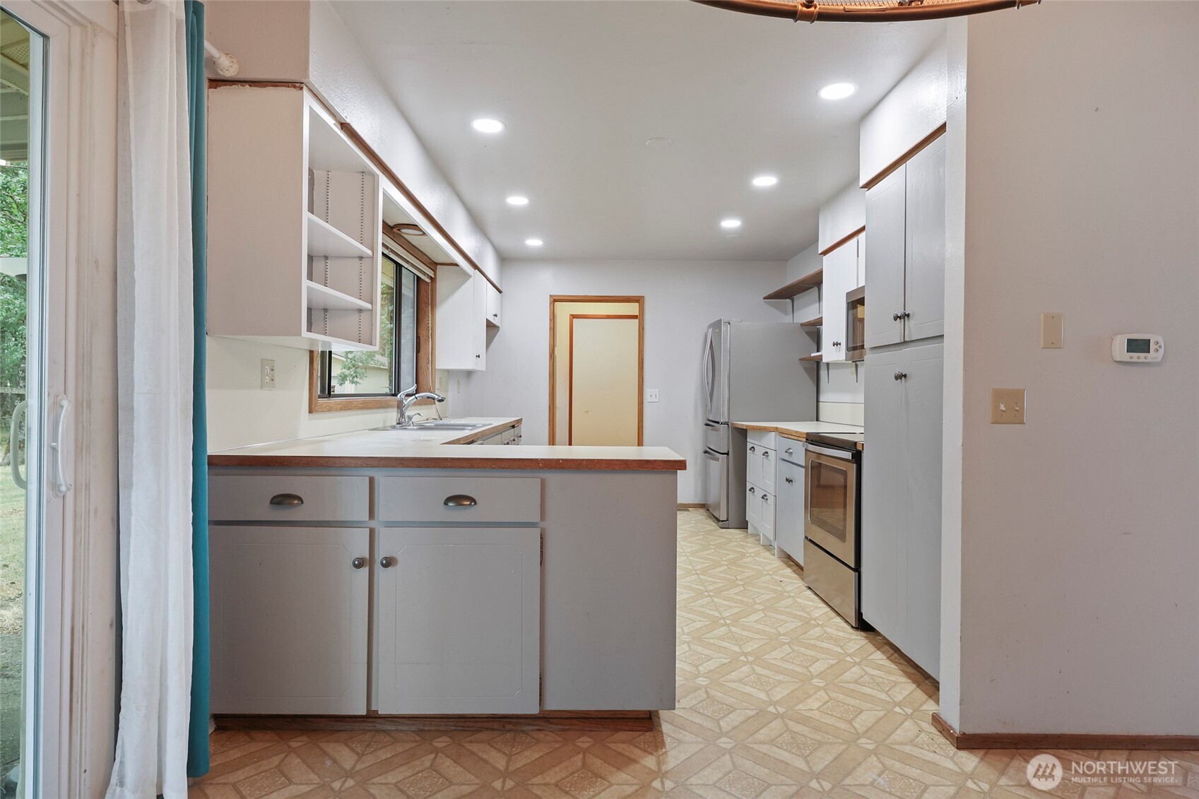 17215 Gibson Road Southwest Tenino, WA 98589 - Photo 5 of 40 a view of a kitchen with electric appliances