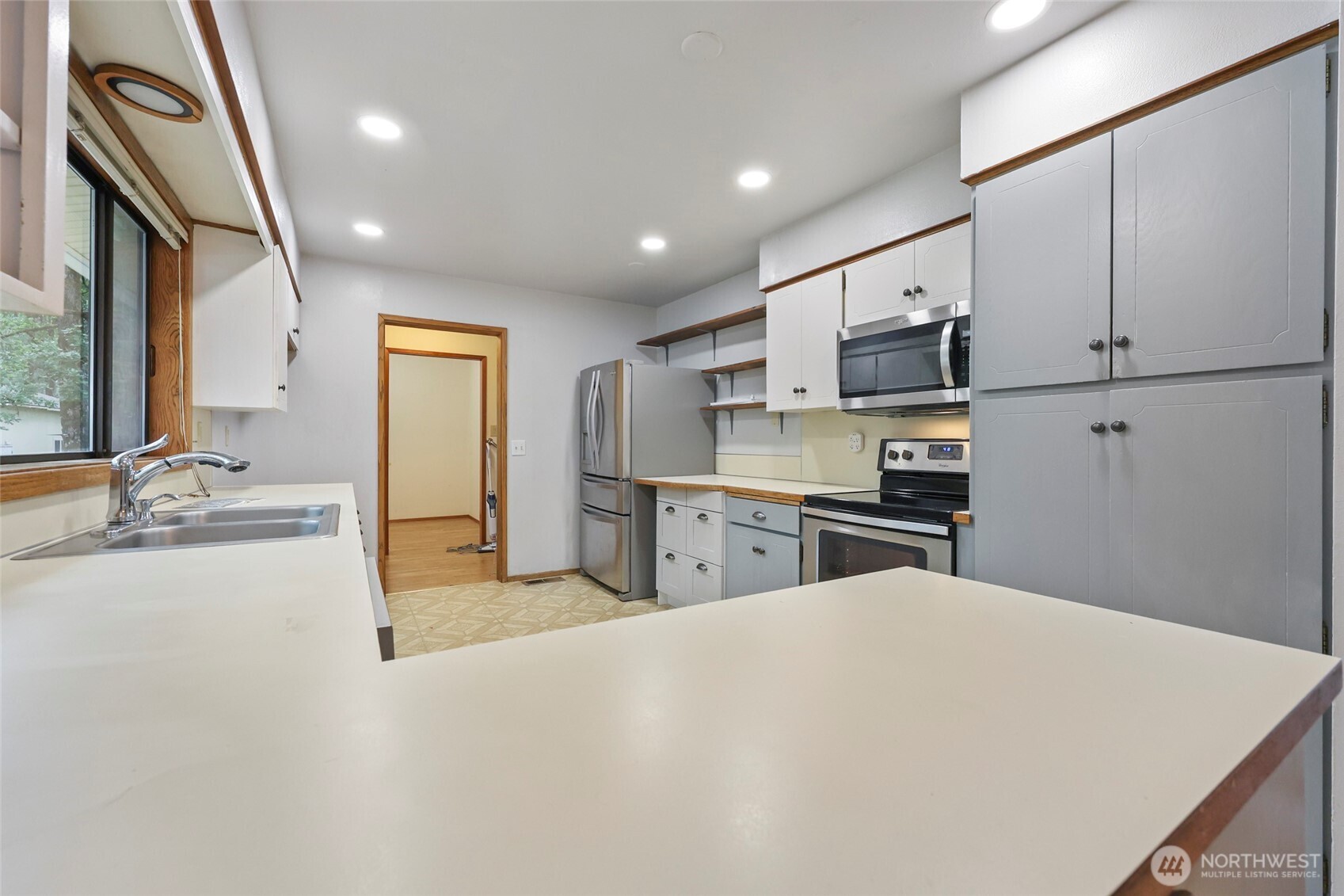 17215 Gibson Road Southwest Tenino, WA 98589 - Photo 6 of 40 a kitchen with stainless steel appliances a sink and a refrigerator