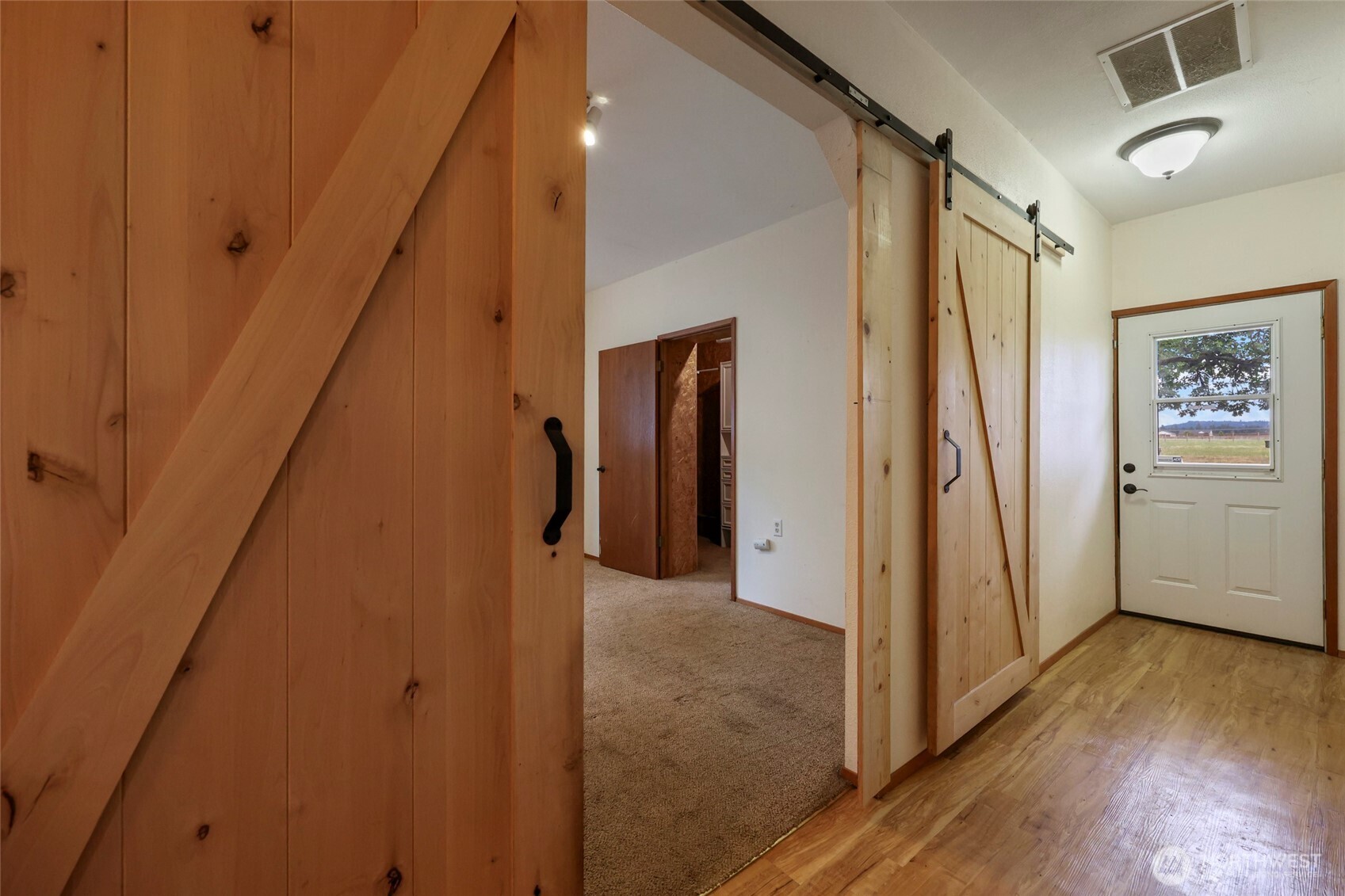 17215 Gibson Road Southwest Tenino, WA 98589 - Photo 10 of 40 a view of hallway with stairs and wooden floor