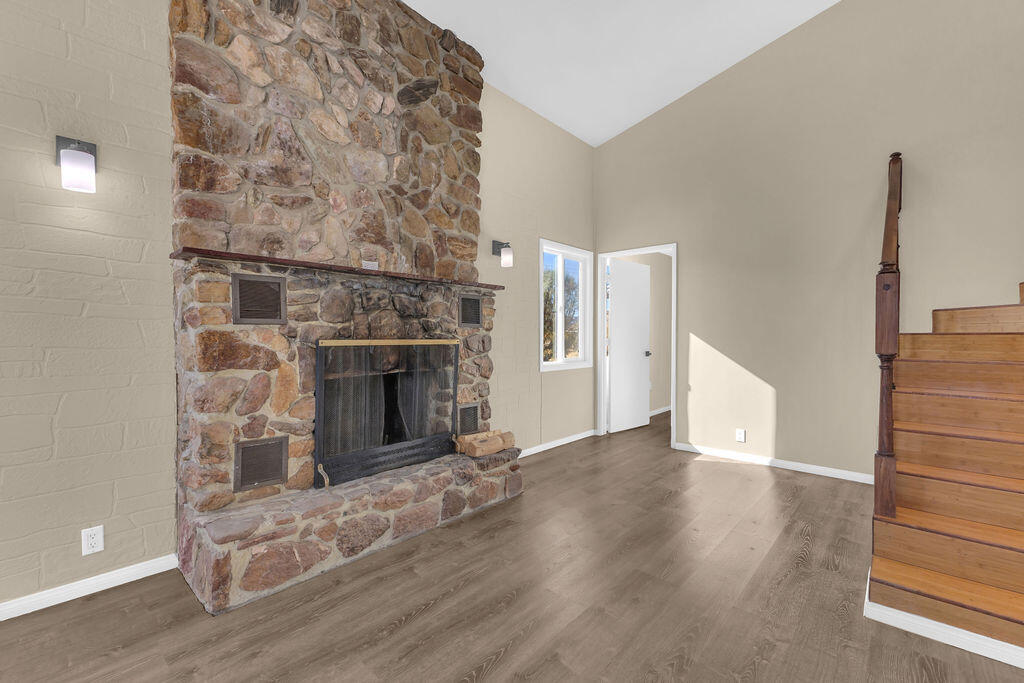 51088 Mecca Road Morongo Valley, CA 92256 - Photo 12 of 77 a view of a livingroom with a fireplace and window