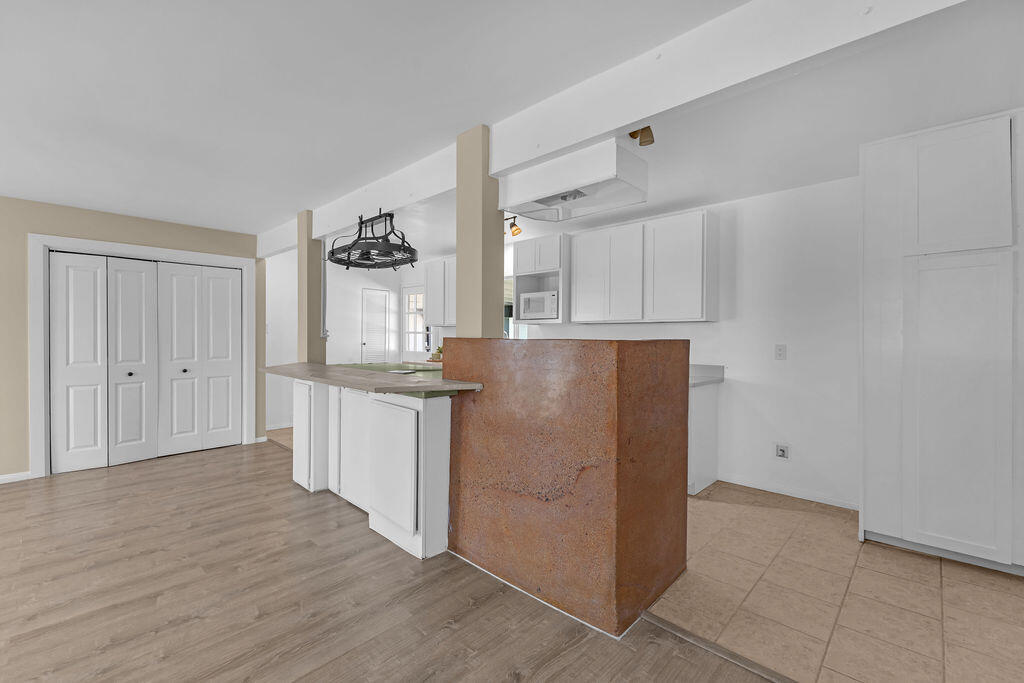 51088 Mecca Road Morongo Valley, CA 92256 - Photo 19 of 77 a kitchen with granite countertop cabinets and wooden floor